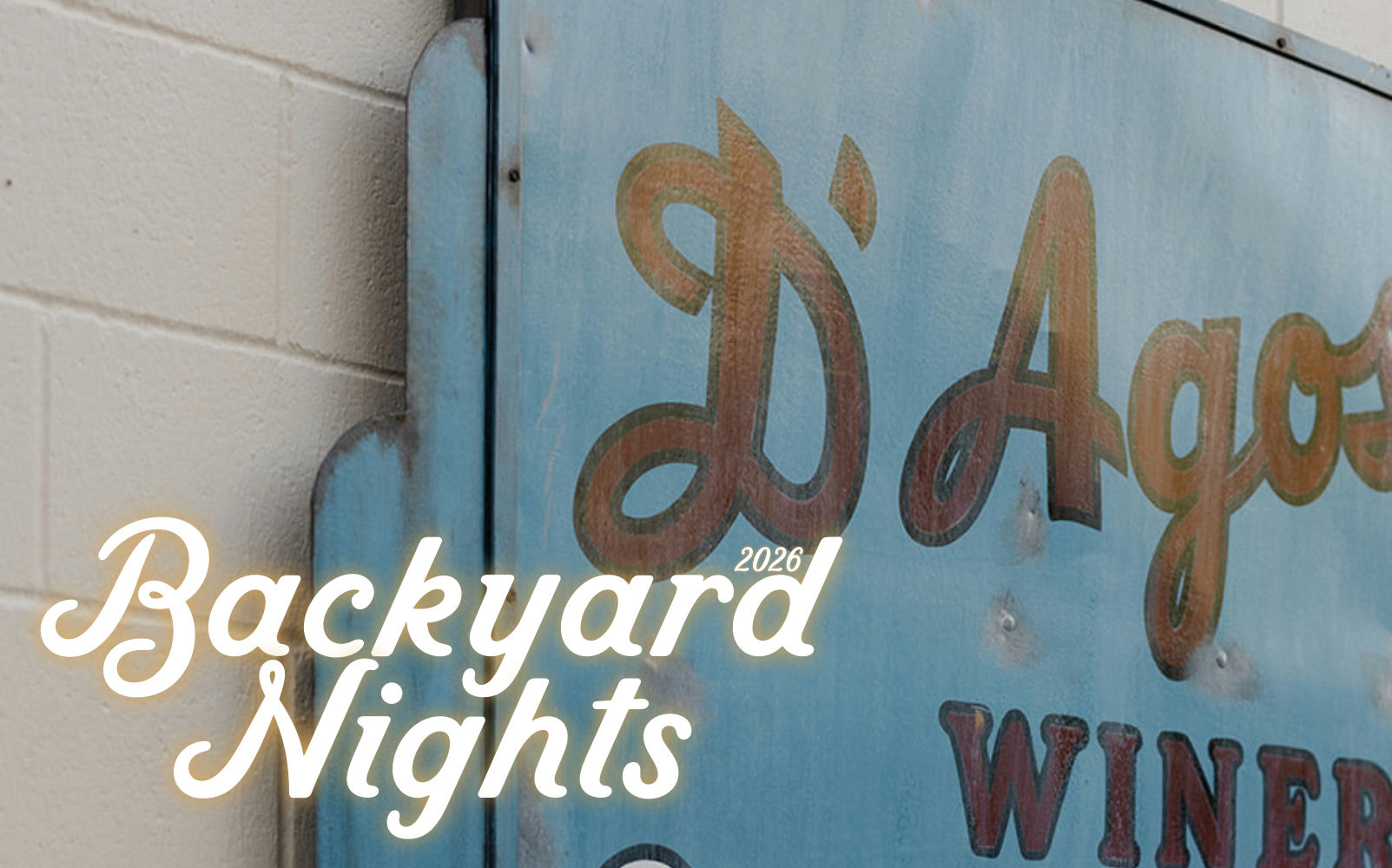 Weathered blue sign with rusty metal lettering for D'Agostini winery, with "Backyard Nights 2026" text overlaid.